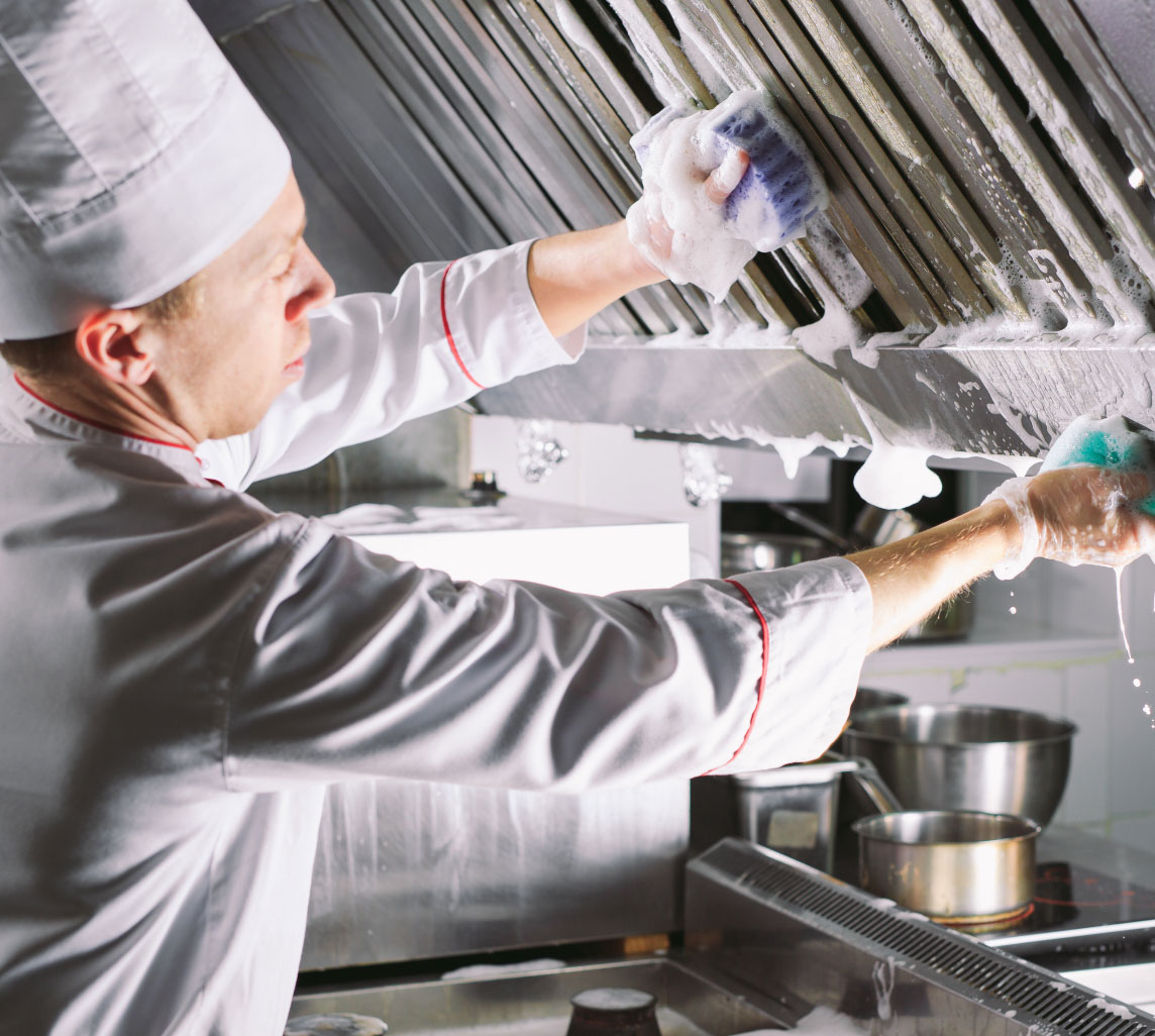 chef cleaning kitchen