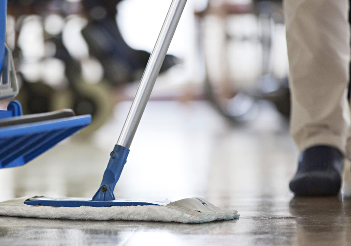 person mopping floor